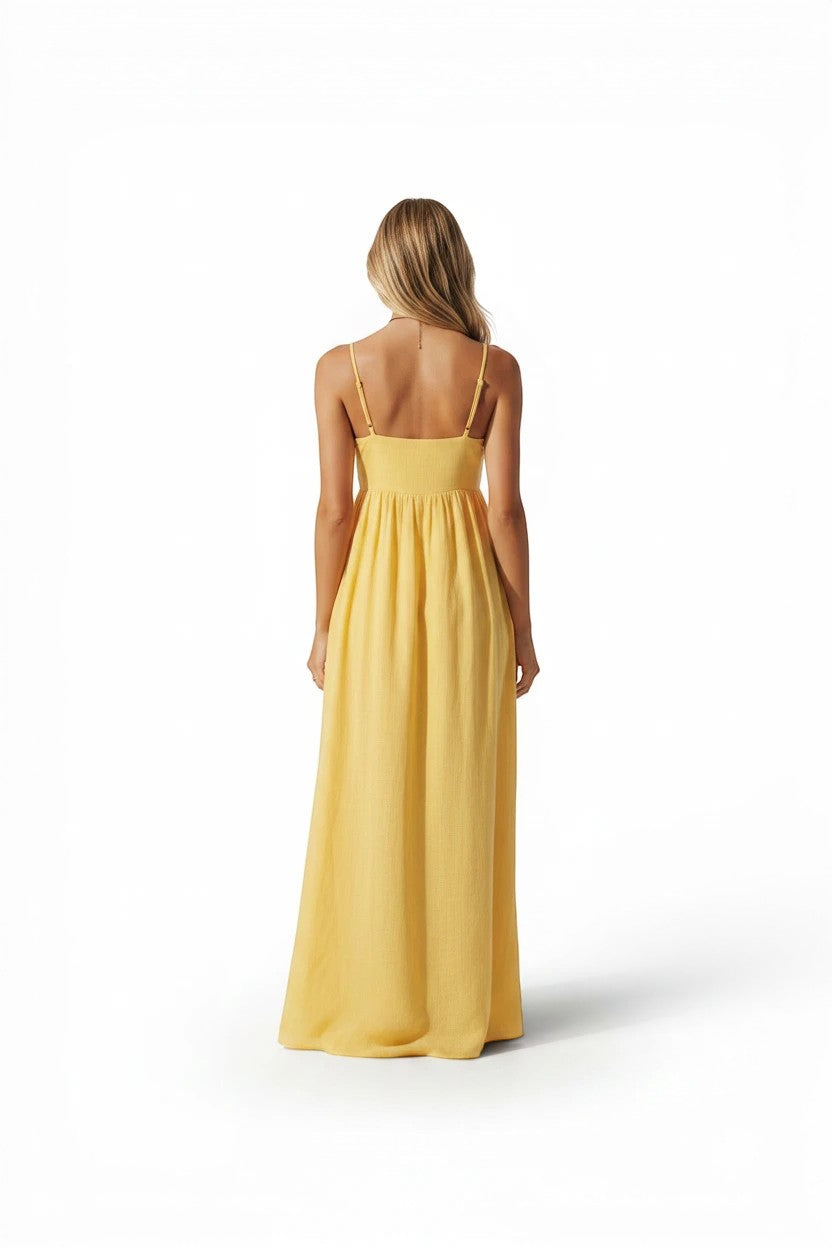 Vue arrière d'une robe longue Valerelle couleur mangue à fines bretelles, coupe fluide et dos nu pour demoiselle d'honneur