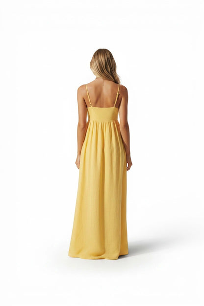 Vue arrière d'une robe longue Valerelle couleur mangue à fines bretelles, coupe fluide et dos nu pour demoiselle d'honneur